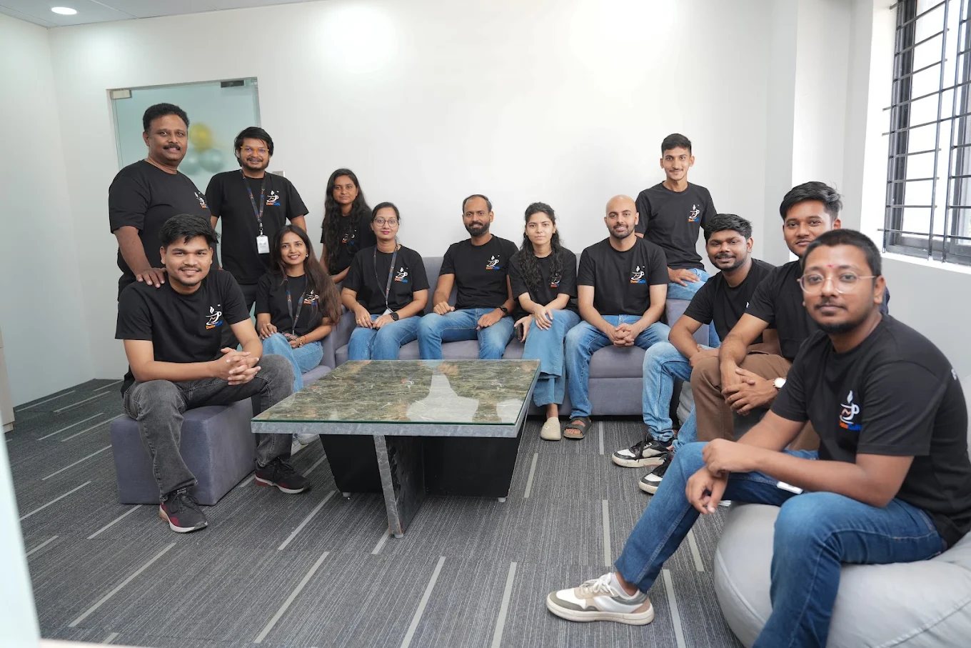 The team gathered in the office lounge