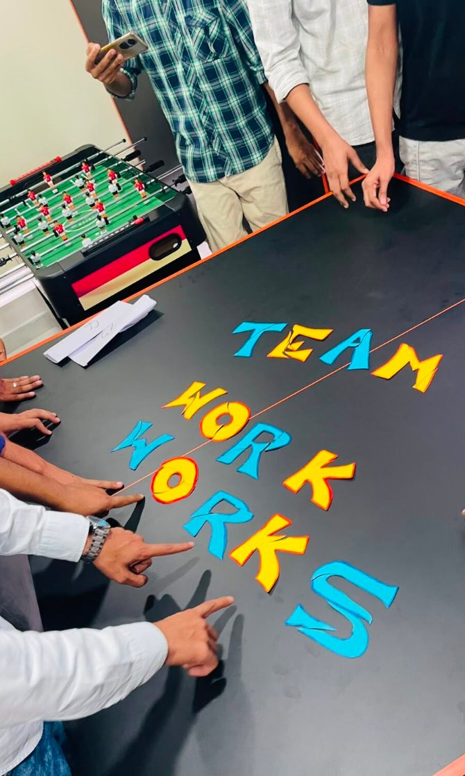 A “Team Work Works” message spelled out on a table